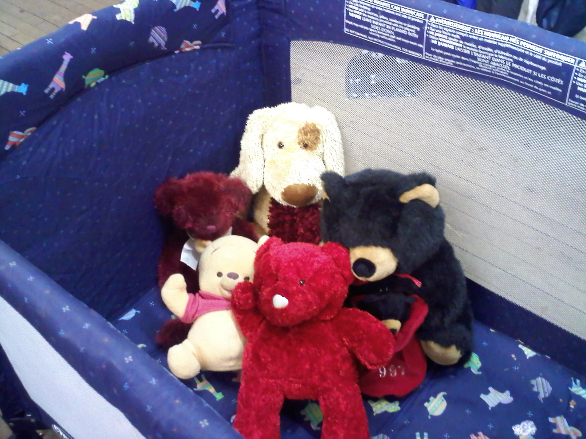 Portable Crib with Stuffed Friends