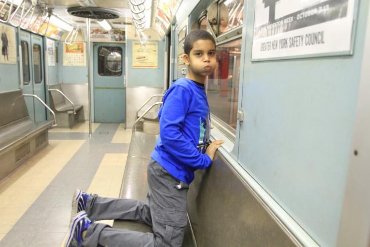Ian Aquino, 9, at the Transit Museum in Brooklyn, where he participates in the museum's Subway Sleuth program which lets kids with autism learn about trains and buses in a safe way. Brooklyn, New York, Friday, November 11, 2016. (Jesse Ward for New York Daily News)