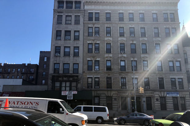 Tenants of this building are suing their landlord, claiming that the landlord illegally deregulated rent-stabilized units while receiving tax abatements form the city. 